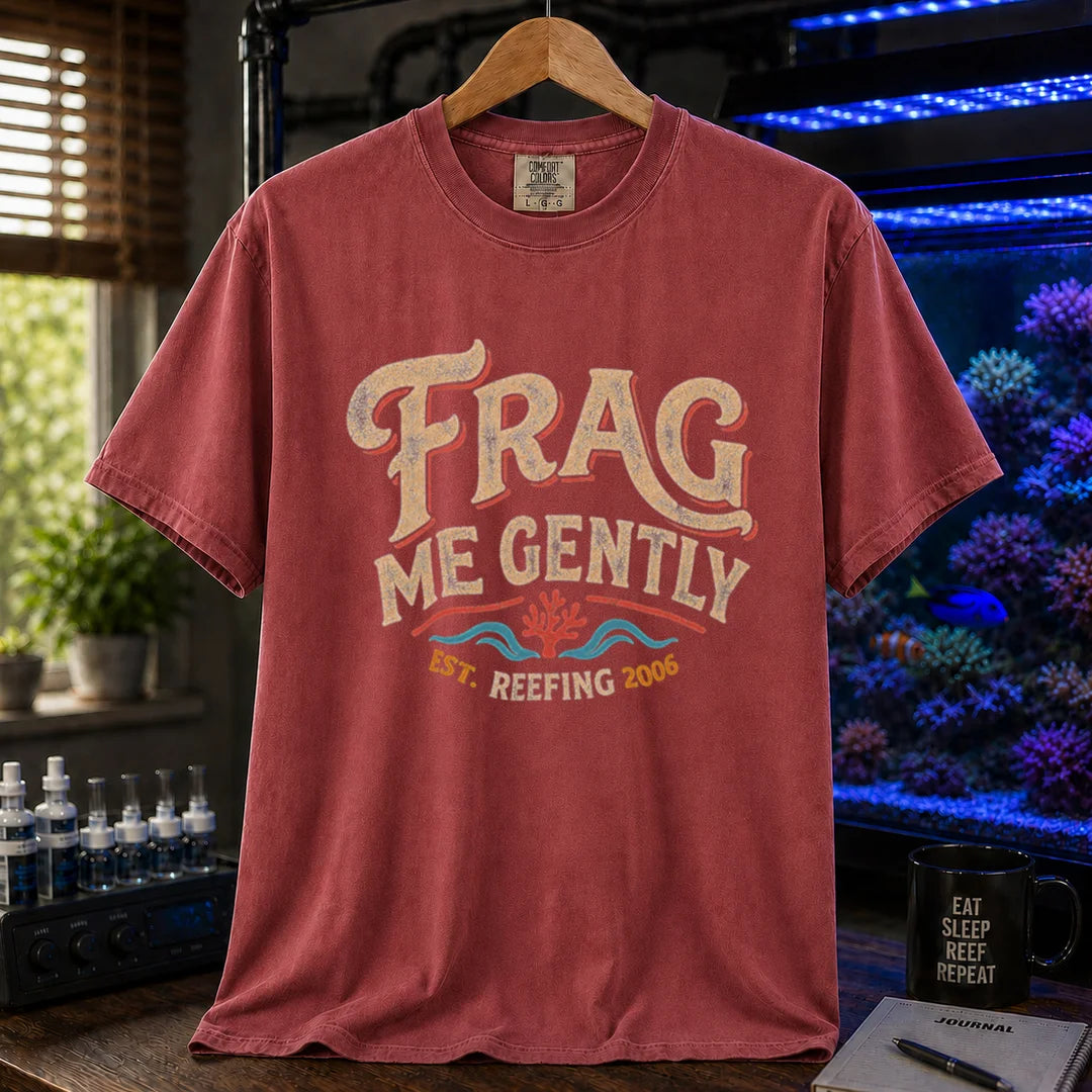 Saltwater aquarium graphic t-shirt featuring distressed vintage cream typography reading Frag Me Gently with coral graphics and Est. Reefing 2006, maroon, red crew neck tee