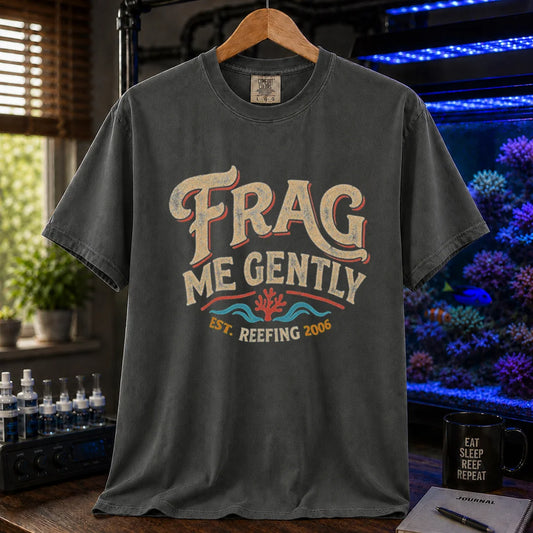 Saltwater aquarium graphic t-shirt featuring distressed vintage cream typography reading Frag Me Gently with coral graphics and Est. Reefing 2006, dark grey crew neck tee