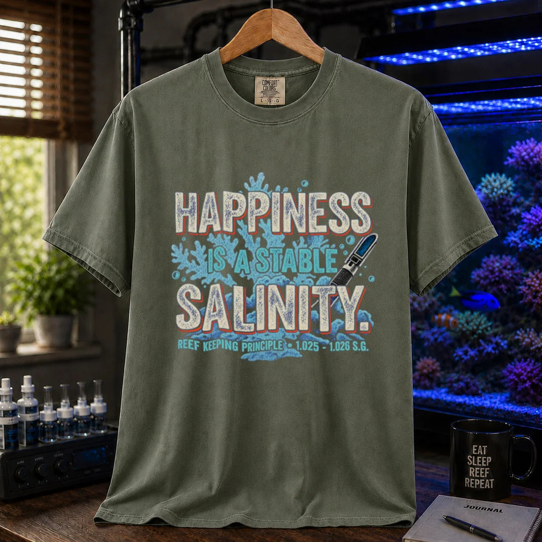 Saltwater aquarium graphic t-shirt featuring distressed retro typography reading Happiness Is A Stable Salinity with coral and refractometer illustrations, military green crew neck tee