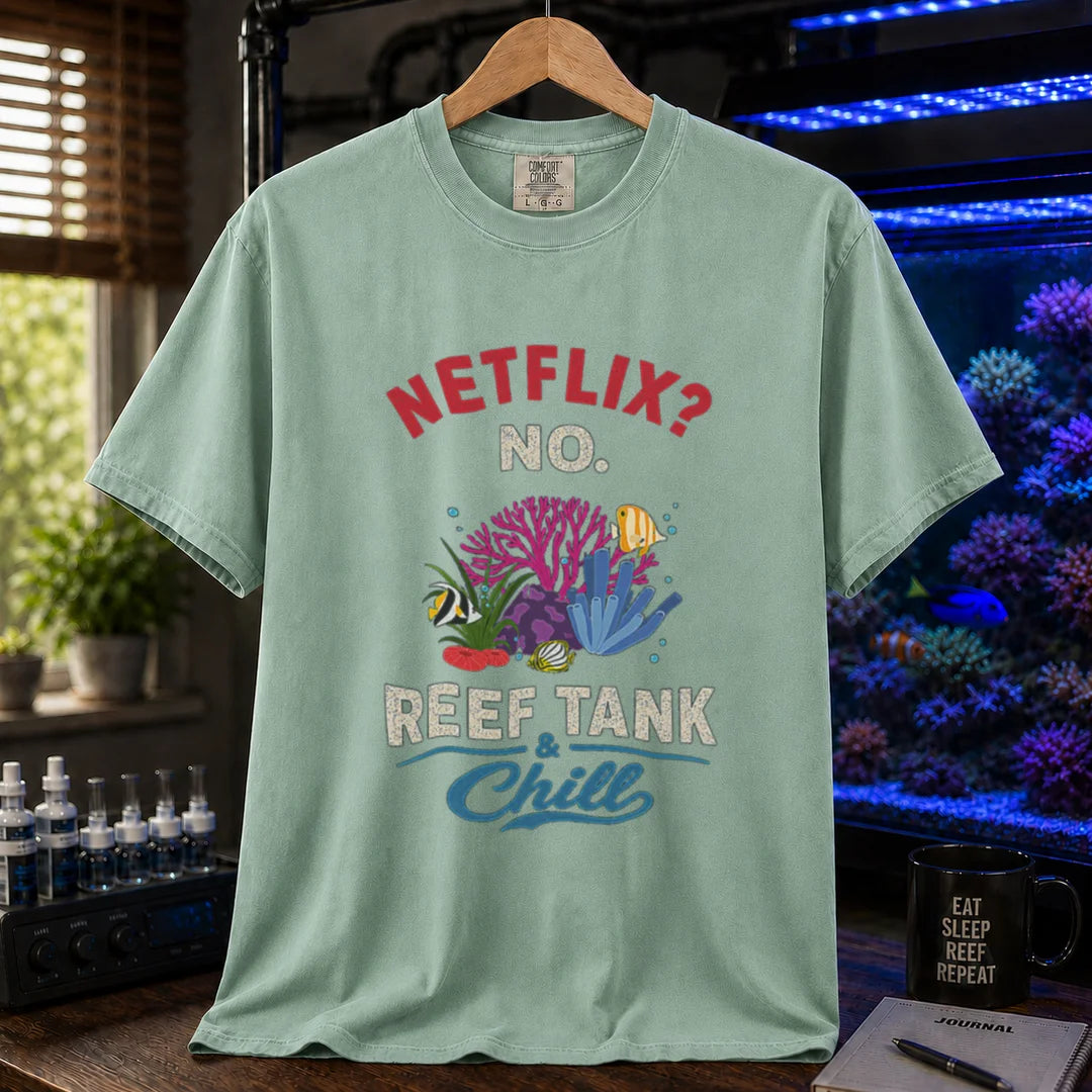 Saltwater aquarium graphic t-shirt featuring red and white typography reading Netflix? No. Reef Tank & Chill with a colorful coral and fish illustration, light green crew neck tee