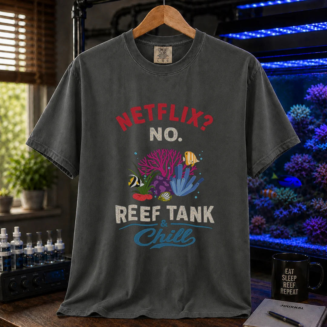Saltwater aquarium graphic t-shirt featuring red and white typography reading Netflix? No. Reef Tank & Chill with a colorful coral and fish illustration, dark grey crew neck tee
