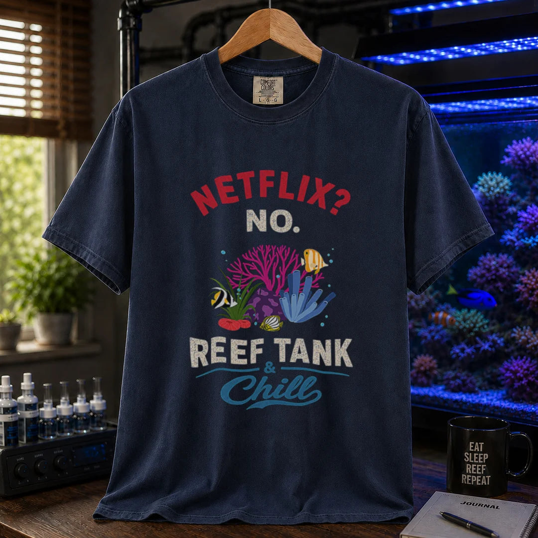Saltwater aquarium graphic t-shirt featuring red and white typography reading Netflix? No. Reef Tank & Chill with a colorful coral and fish illustration, navy crew neck tee