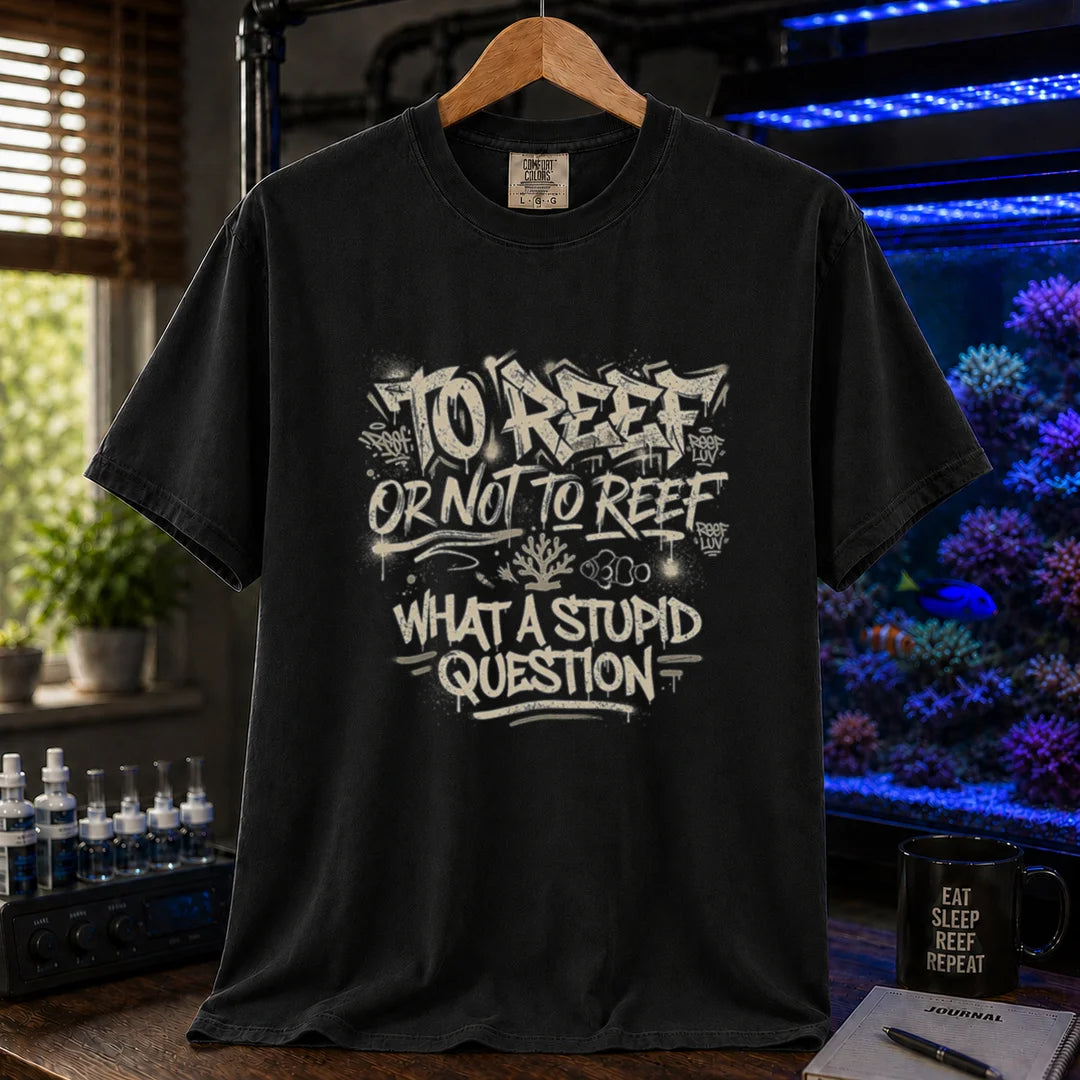 Saltwater aquarium graphic t-shirt featuring distressed white graffiti-style typography reading To Reef Or Not To Reef What A Stupid Question with coral and clownfish icons, black crew neck tee