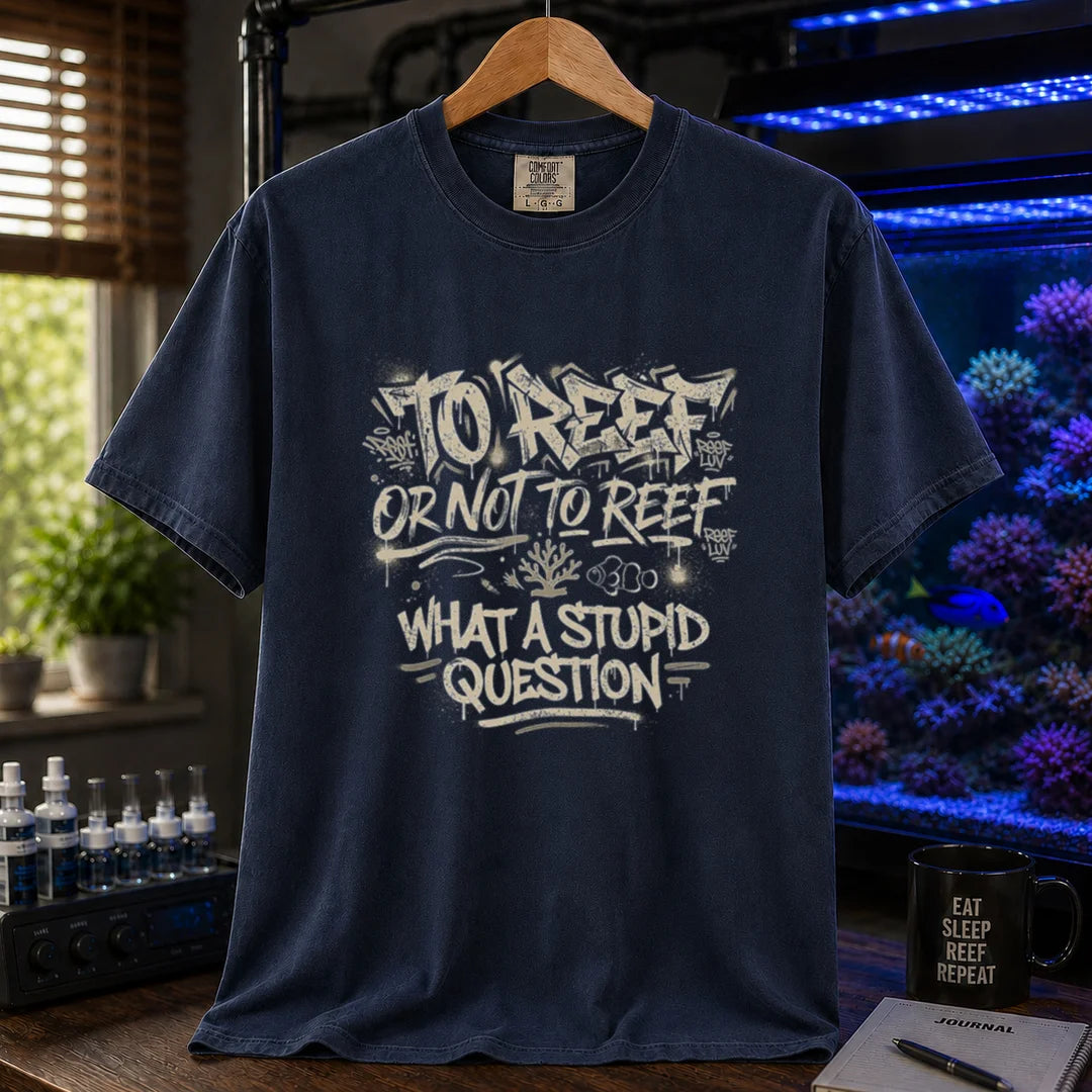 Saltwater aquarium graphic t-shirt featuring distressed white graffiti-style typography reading To Reef Or Not To Reef What A Stupid Question with coral and clownfish icons, navy crew neck tee