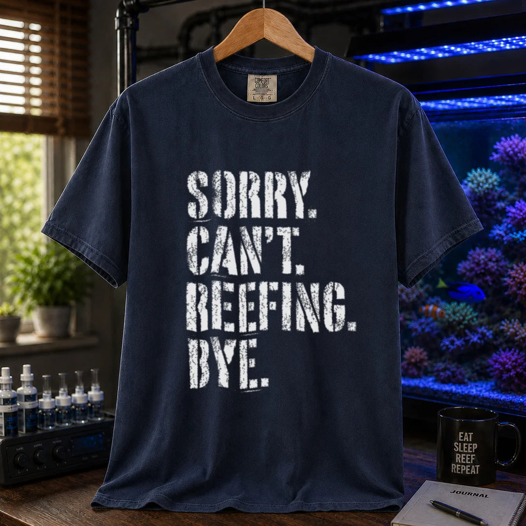 Saltwater aquarium graphic t-shirt featuring distressed white typography reading Sorry. Can't. Reefing. Bye., navy crew neck tee