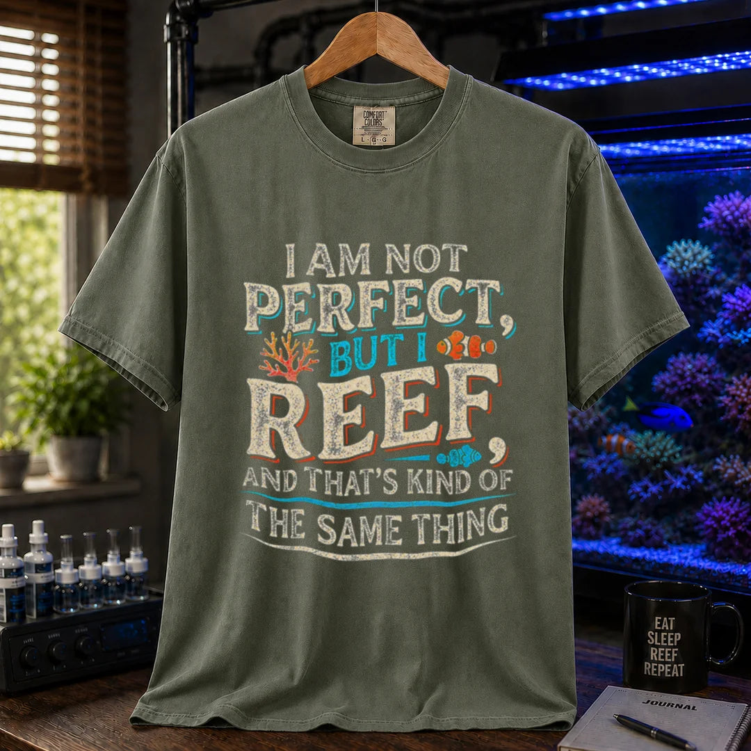 Saltwater aquarium graphic t-shirt featuring distressed multi-color typography reading I Am Not Perfect, But I Reef, And That's Kind Of The Same Thing with coral and clownfish graphics, military green crew neck tee