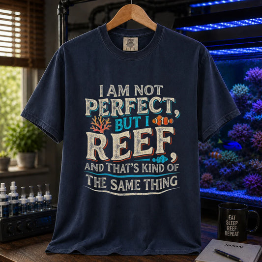 Saltwater aquarium graphic t-shirt featuring distressed multi-color typography reading I Am Not Perfect, But I Reef, And That's Kind Of The Same Thing with coral and clownfish graphics, navy crew neck tee