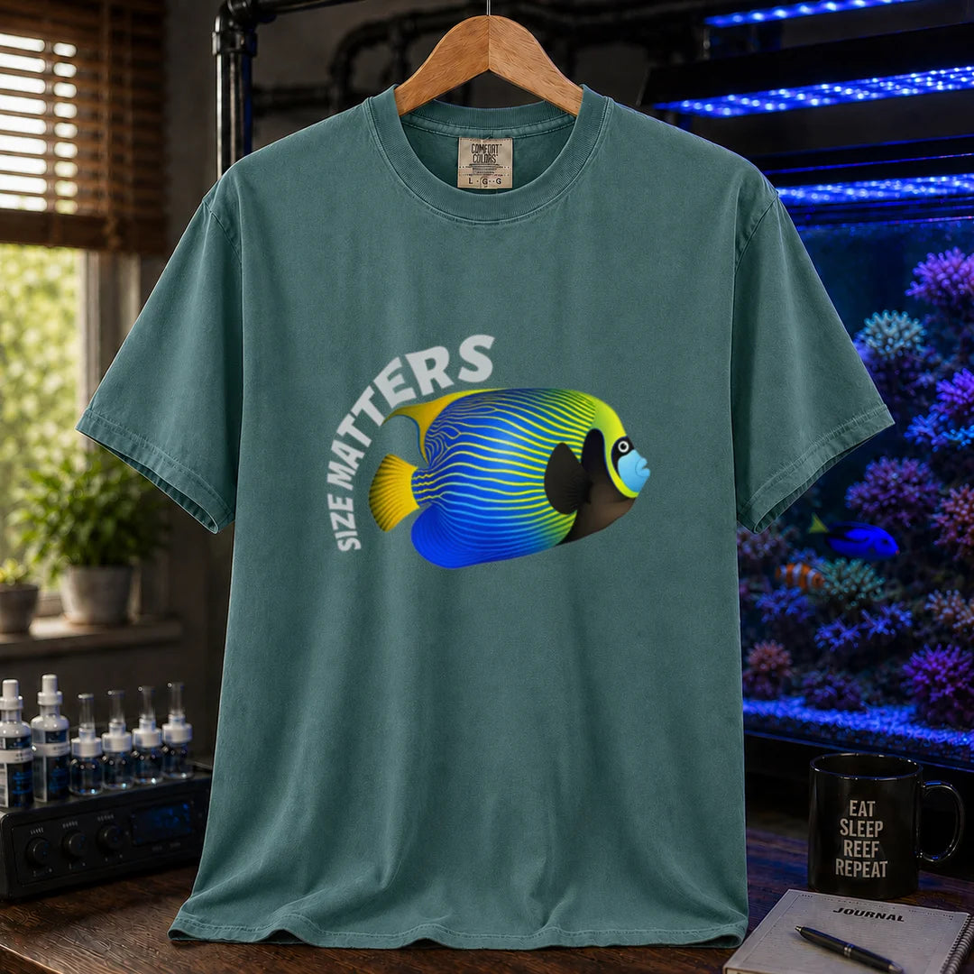 Saltwater aquarium graphic t-shirt featuring arched white typography reading Size Matters with an illustrated Emperor Angelfish, green crew neck tee