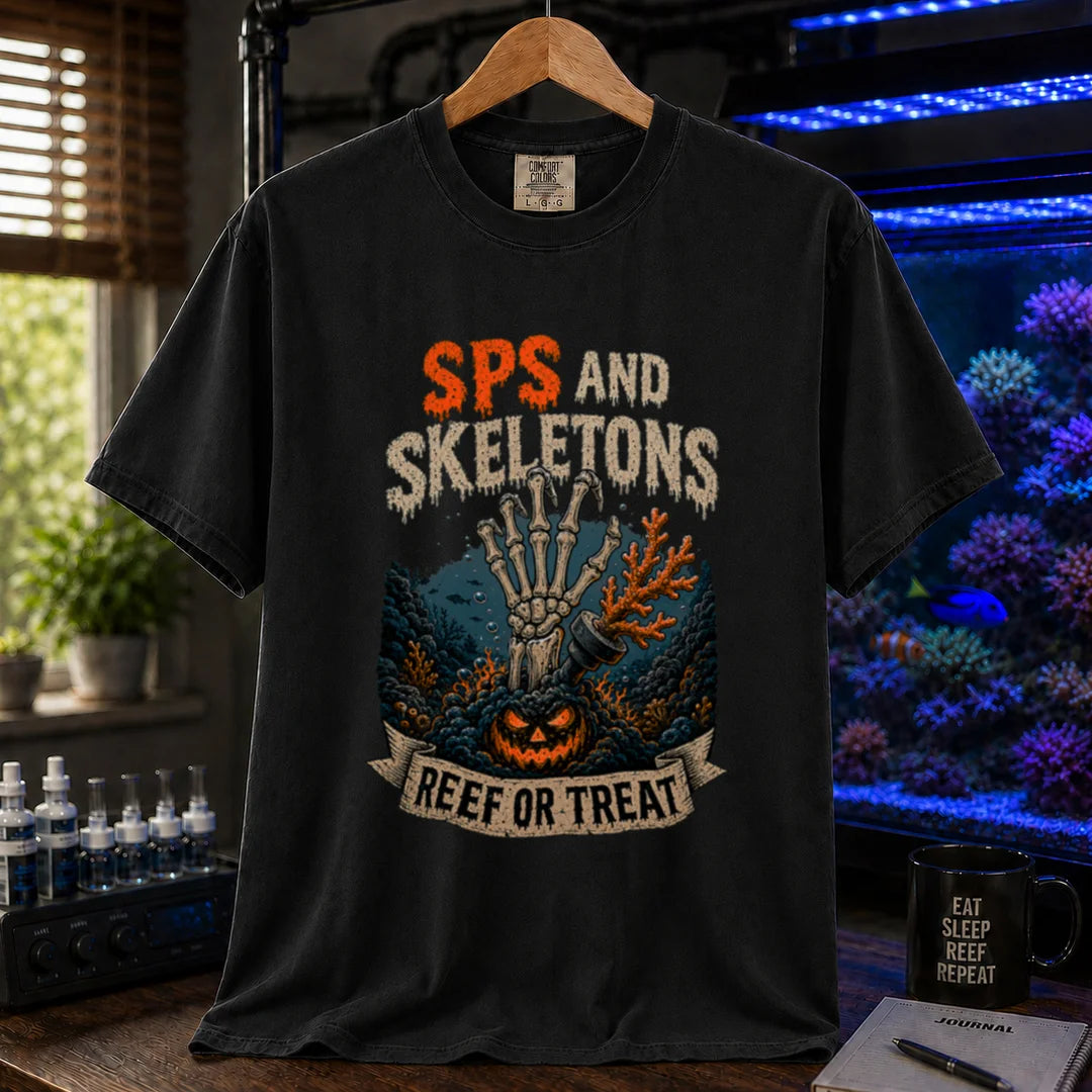 Saltwater aquarium graphic t-shirt featuring orange and white distressed typography reading SPS And Skeletons with an underwater jack-o'-lantern, skeletal hand, and a banner reading Reef Or Treat, black crew neck tee