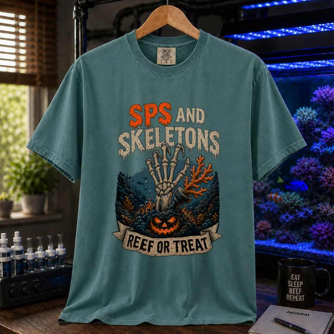 Saltwater aquarium graphic t-shirt featuring orange and white distressed typography reading SPS And Skeletons with an underwater jack-o'-lantern, skeletal hand, and a banner reading Reef Or Treat, green crew neck tee
