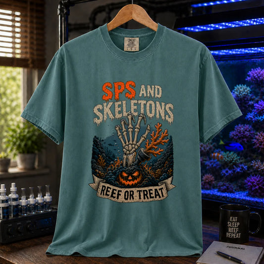 Saltwater aquarium graphic t-shirt featuring orange and white distressed typography reading SPS And Skeletons with an underwater jack-o'-lantern, skeletal hand, and a banner reading Reef Or Treat, green crew neck tee