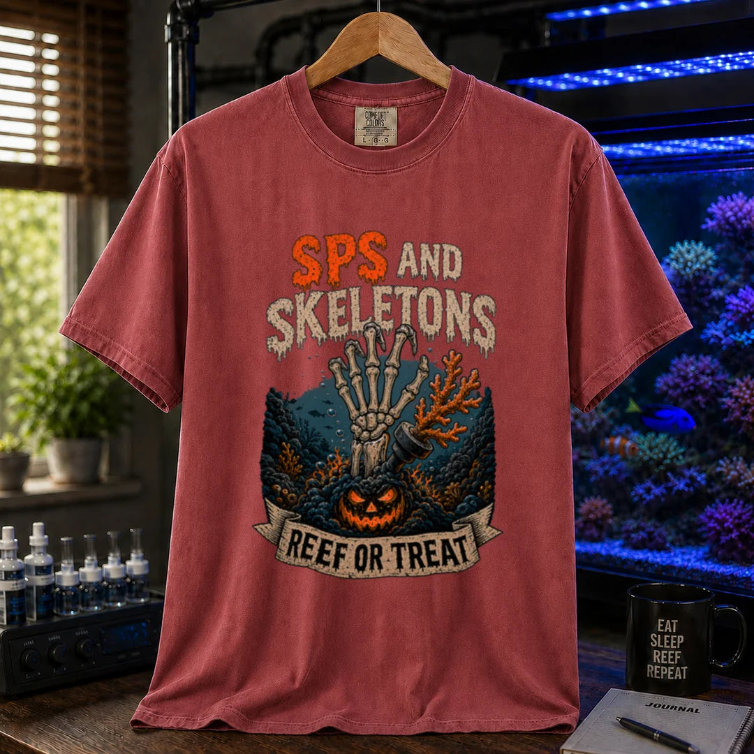 Saltwater aquarium graphic t-shirt featuring orange and white distressed typography reading SPS And Skeletons with an underwater jack-o'-lantern, skeletal hand, and a banner reading Reef Or Treat, maroon, red crew neck tee