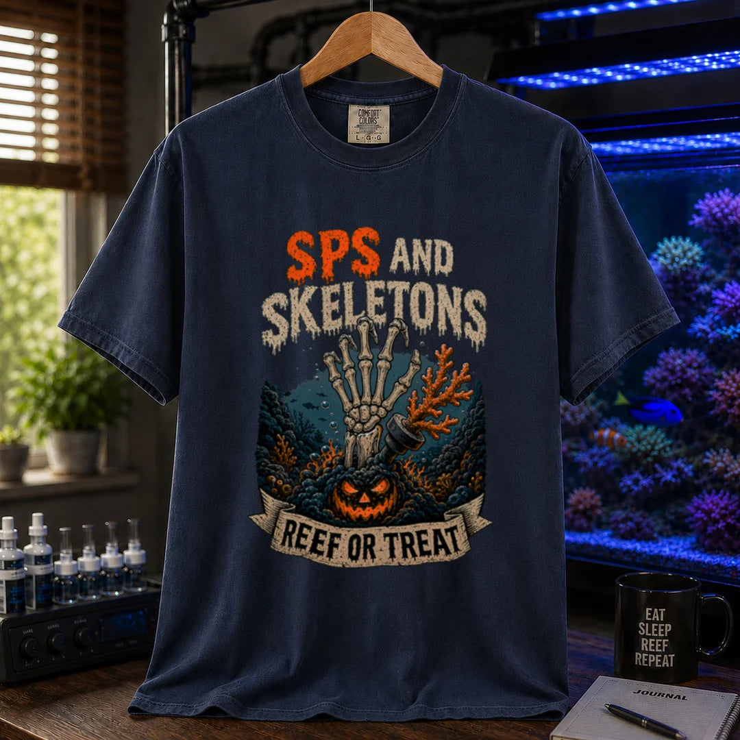Saltwater aquarium graphic t-shirt featuring orange and white distressed typography reading SPS And Skeletons with an underwater jack-o'-lantern, skeletal hand, and a banner reading Reef Or Treat, navy crew neck tee