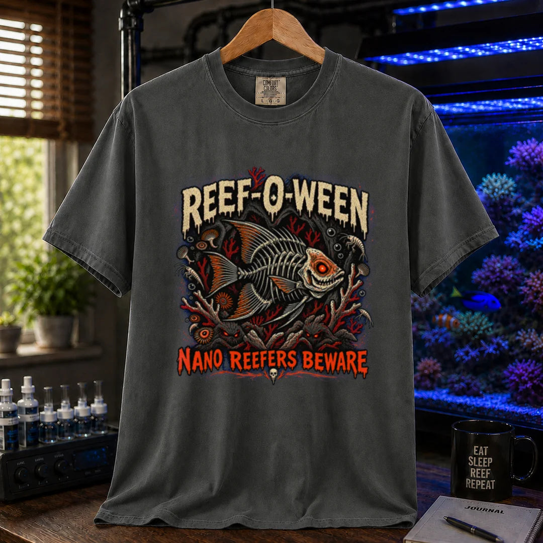 Saltwater aquarium graphic t-shirt design featuring dripping cream and orange typography reading Reef-O-Ween and Nano Reefers Beware with a glowing-eyed skeletal fish illustration and creepy corals, dark grey crew neck tee