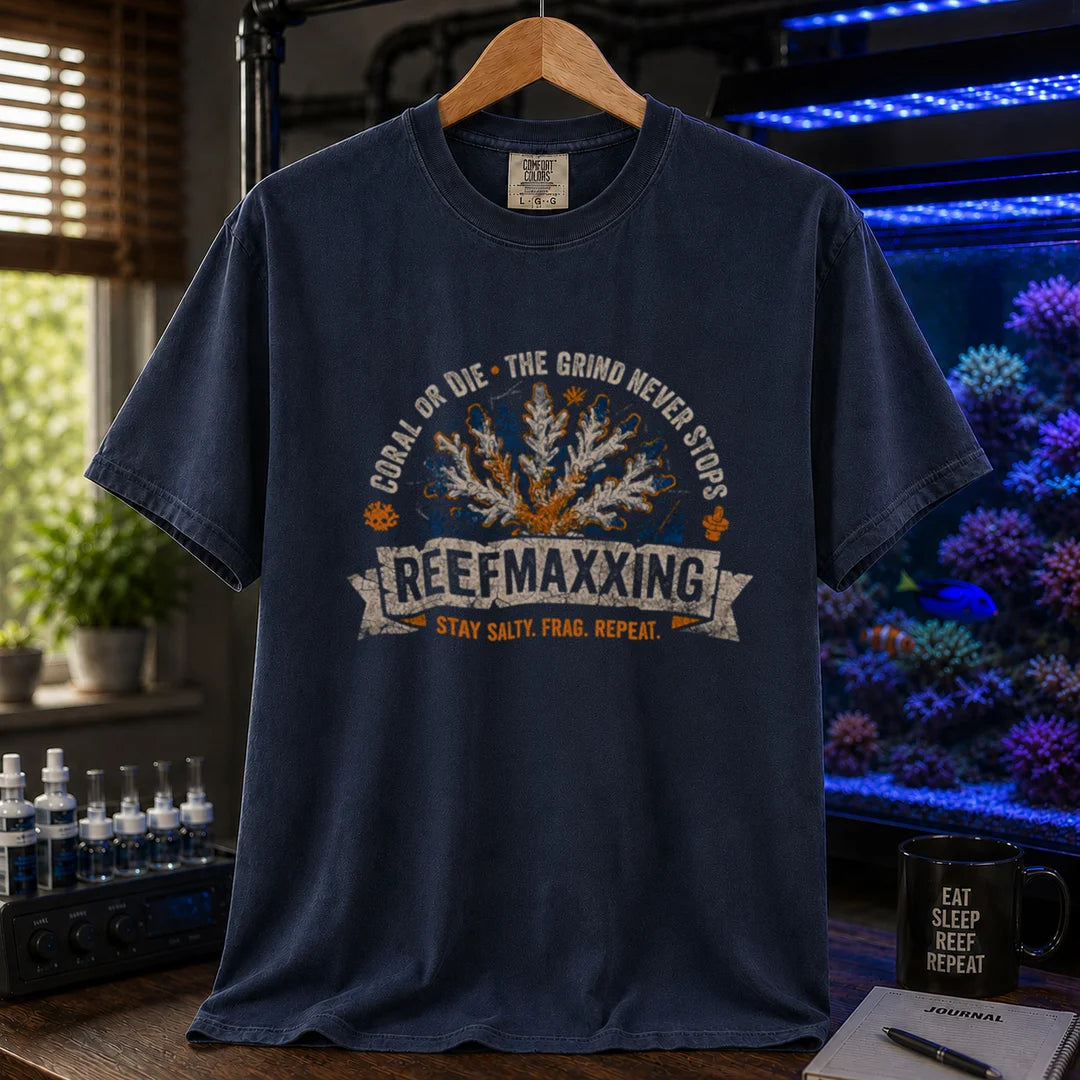 Saltwater aquarium graphic t-shirt design featuring a distressed vintage design reading Reefmaxxxing, Coral Or Die, and Stay Salty. Frag. Repeat. with a central coral graphic on a NAVY tee
