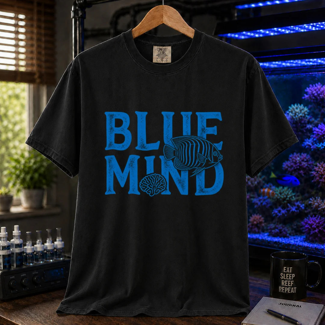 Saltwater aquarium graphic t-shirt design featuring distressed blue typography reading Blue Mind with an angelfish and brain coral illustration on a BLACK tee