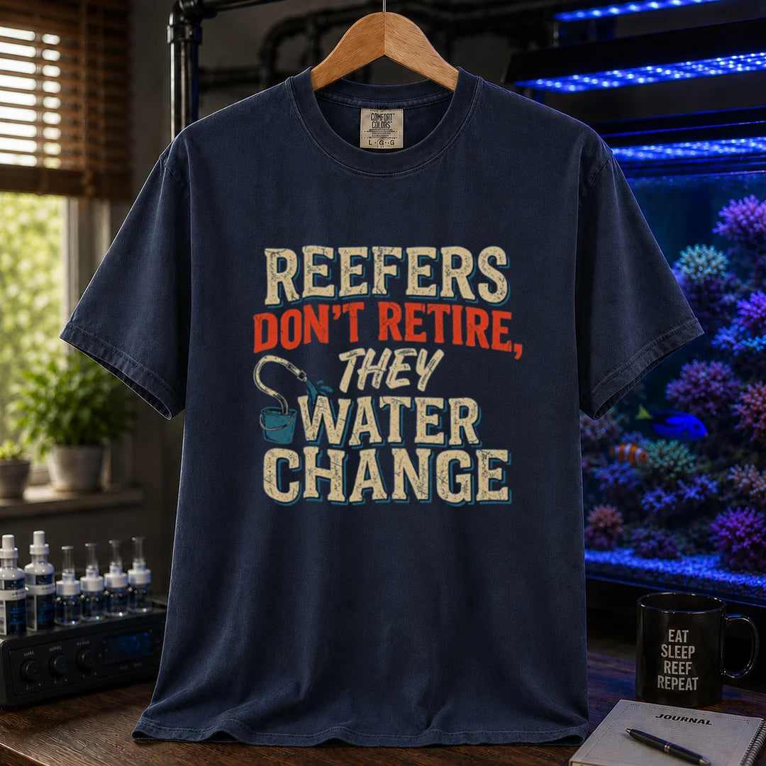 Saltwater aquarium graphic t-shirt design featuring distressed typography reading Reefers Don't Retire, They Water Change with a bucket and siphon illustration on a navy tee