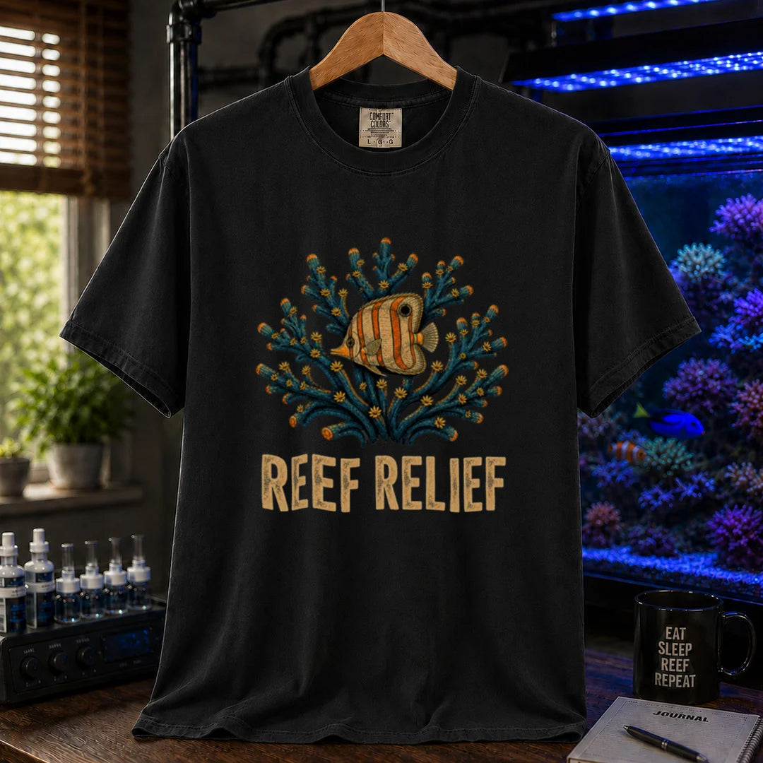 Saltwater aquarium graphic t-shirt design featuring a butterflyfish nestled in a blue coral colony with distressed typography reading Reef Relief on a BLACK tee