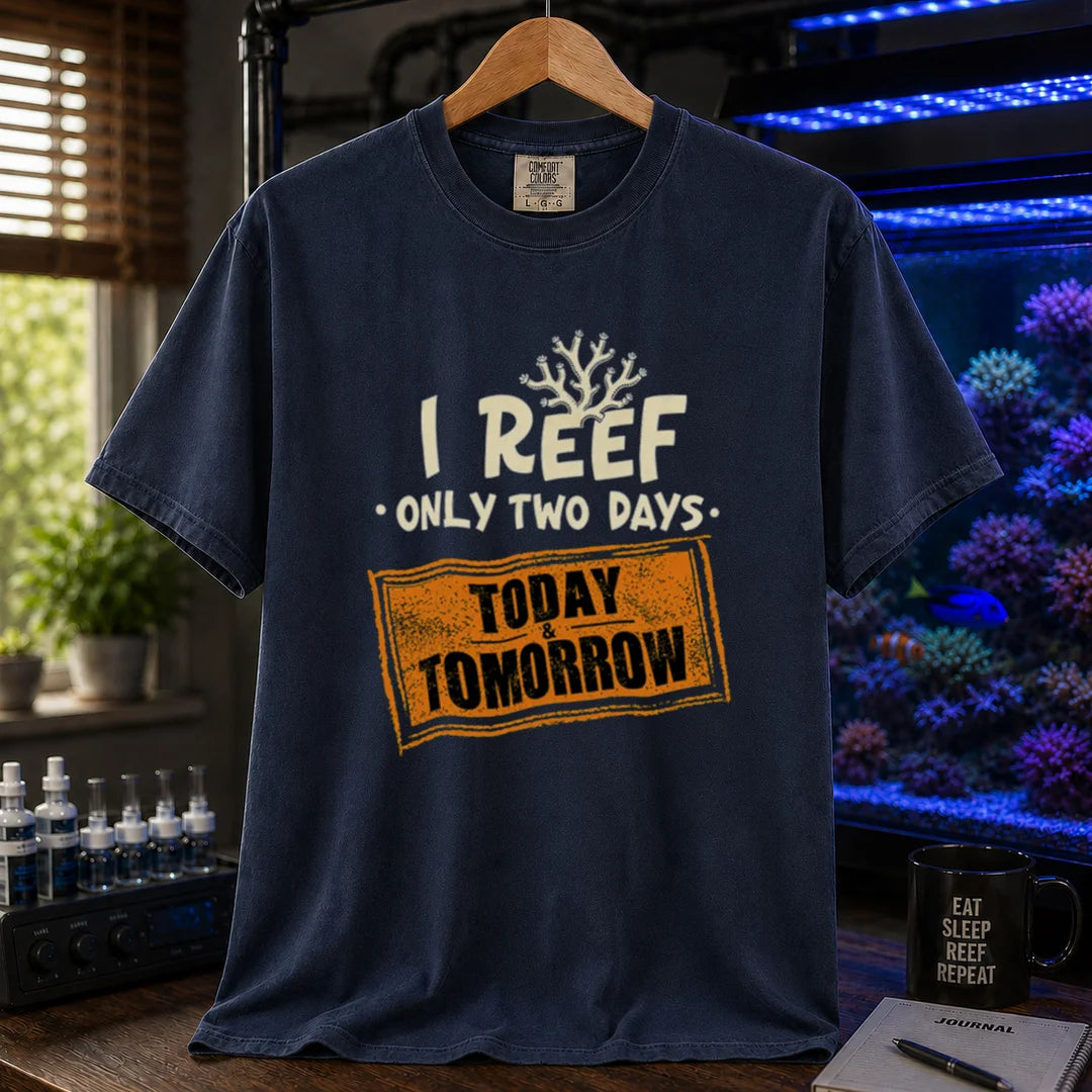 Saltwater aquarium graphic t-shirt design featuring distressed typography reading I Reef Only Two Days. Today & Tomorrow with a coral accent on a navy tee