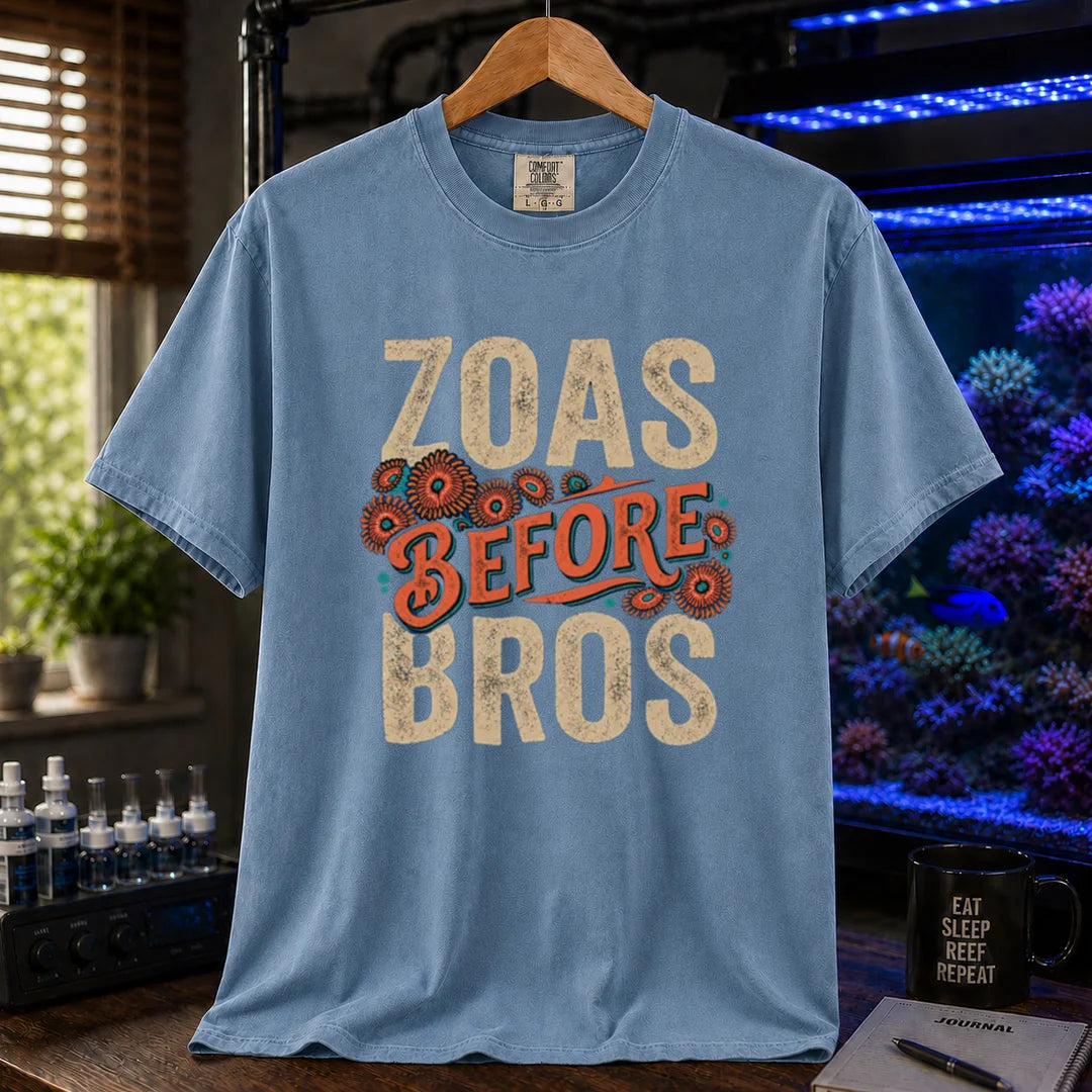 Saltwater aquarium graphic t-shirt design featuring distressed typography reading Zoas Before Bros with colorful zoanthid polyp illustrations on a blue tee