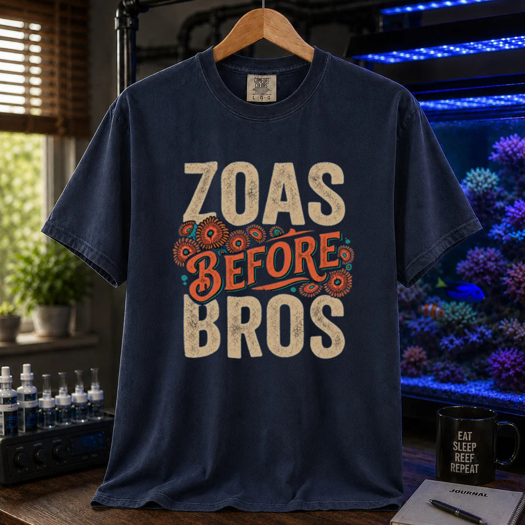 Saltwater aquarium graphic t-shirt design featuring distressed typography reading Zoas Before Bros with colorful zoanthid polyp illustrations on a navy tee