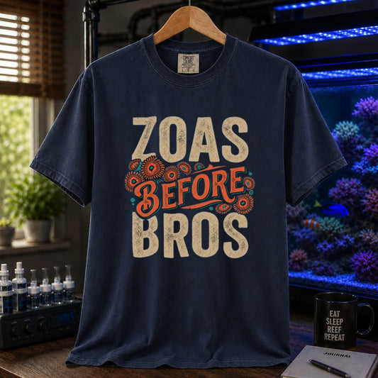 Saltwater aquarium graphic t-shirt design featuring distressed typography reading Zoas Before Bros with colorful zoanthid polyp illustrations on a navy tee