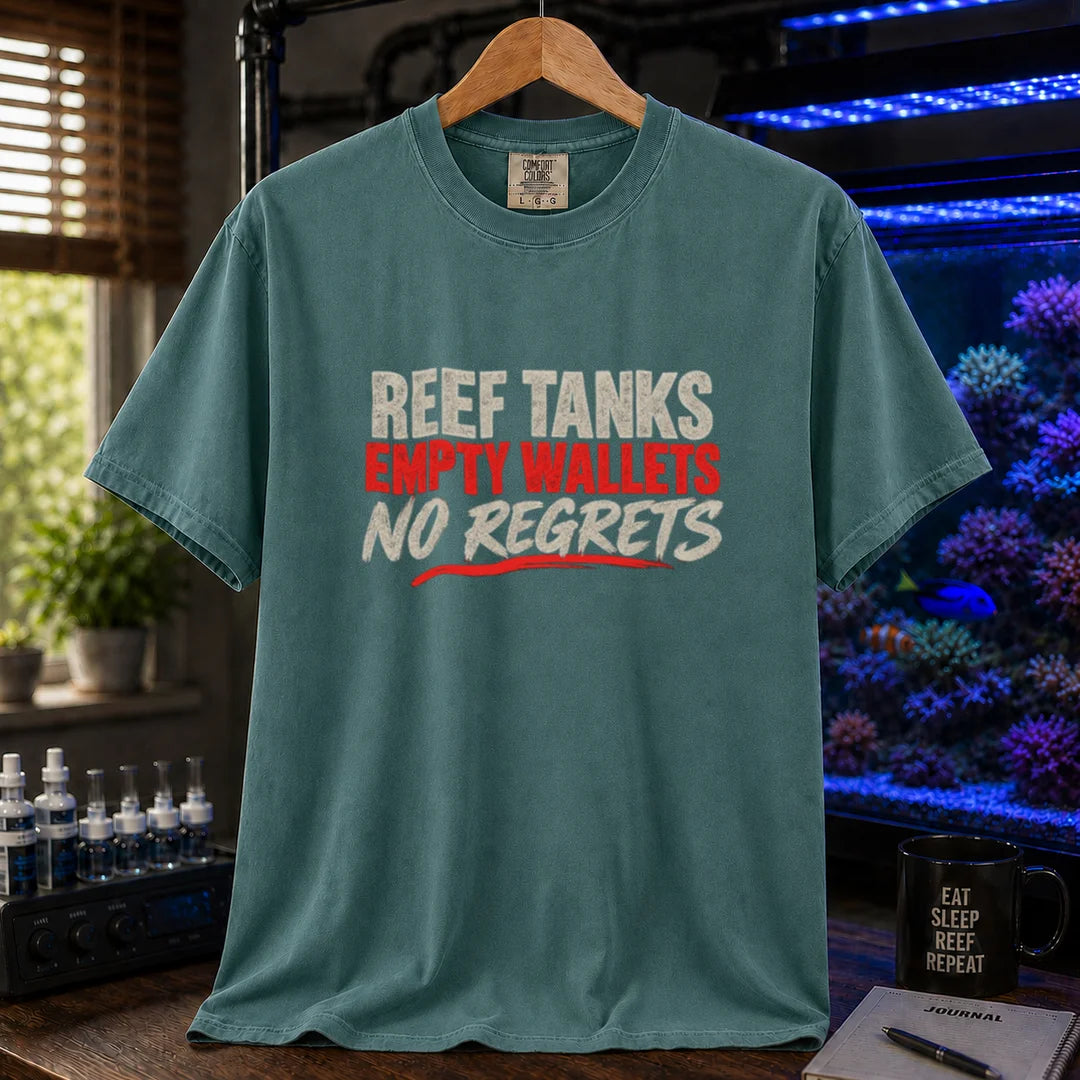 Saltwater aquarium graphic t-shirt featuring distressed cream and red typography reading Reef Tanks, Empty Wallets, No Regrets printed on a green tee displayed in a reef room setting