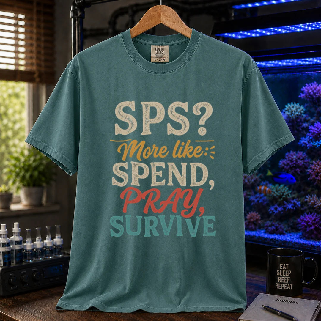 Saltwater aquarium graphic t-shirt featuring distressed vintage typography reading SPS? More Like: Spend, Pray, Survive printed on a green tee displayed in a reef room setting