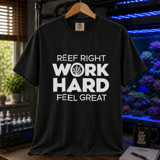 Saltwater aquarium graphic t-shirt featuring high-contrast white block typography reading Reef Right Work Hard Feel Great with a circular coral icon inside the letter O printed on a black tee displayed in a reef room setting