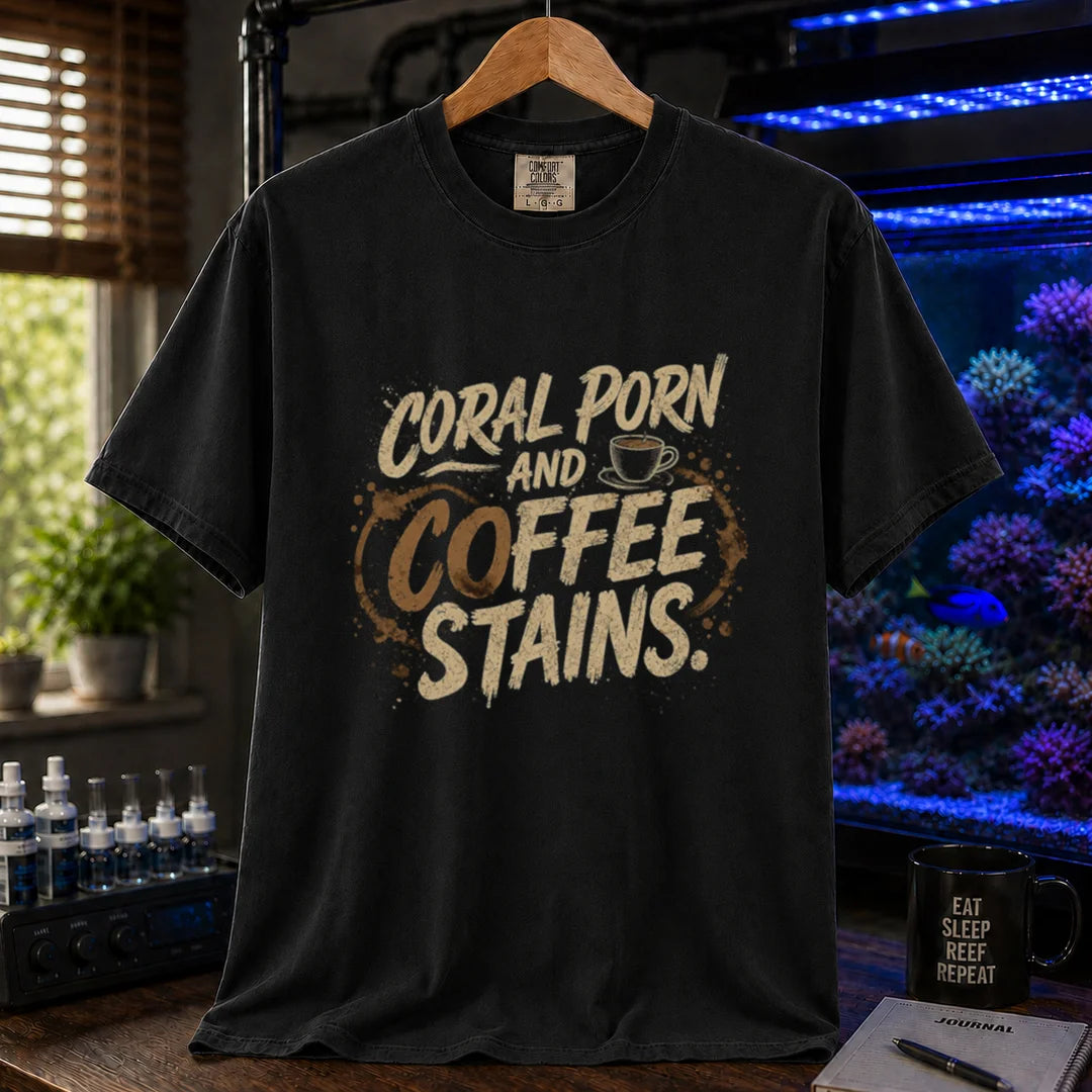 Saltwater aquarium graphic t-shirt featuring distressed typography reading Coral Porn And Coffee Stains with a coffee cup graphic on a black shirt