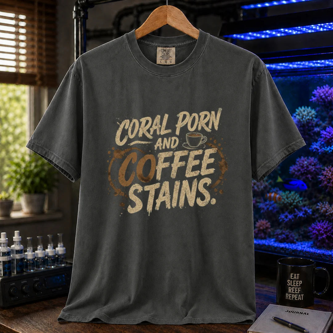 Saltwater aquarium graphic t-shirt featuring distressed typography reading Coral Porn And Coffee Stains with a coffee cup graphic on a dark grey shirt