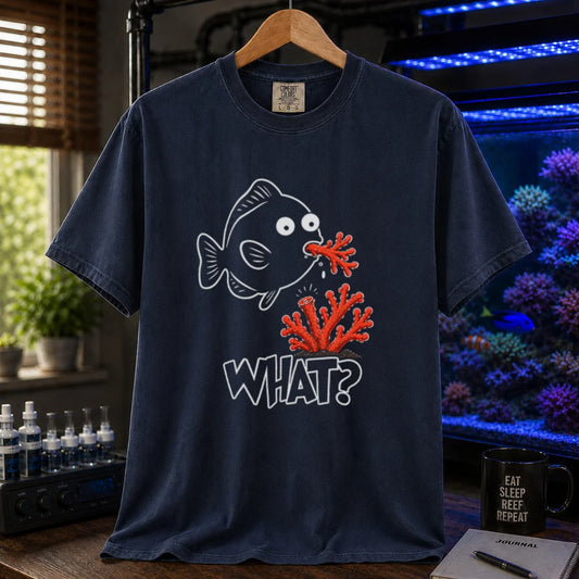 Saltwater aquarium graphic t-shirt featuring a cartoon fish spitting out red coral with text reading What? on a navy shirt