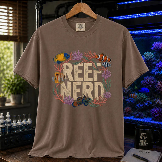 Saltwater aquarium graphic t-shirt featuring distressed block text reading Reef Nerd framed by a detailed wreath of coral and reef fish on a brown shirt
