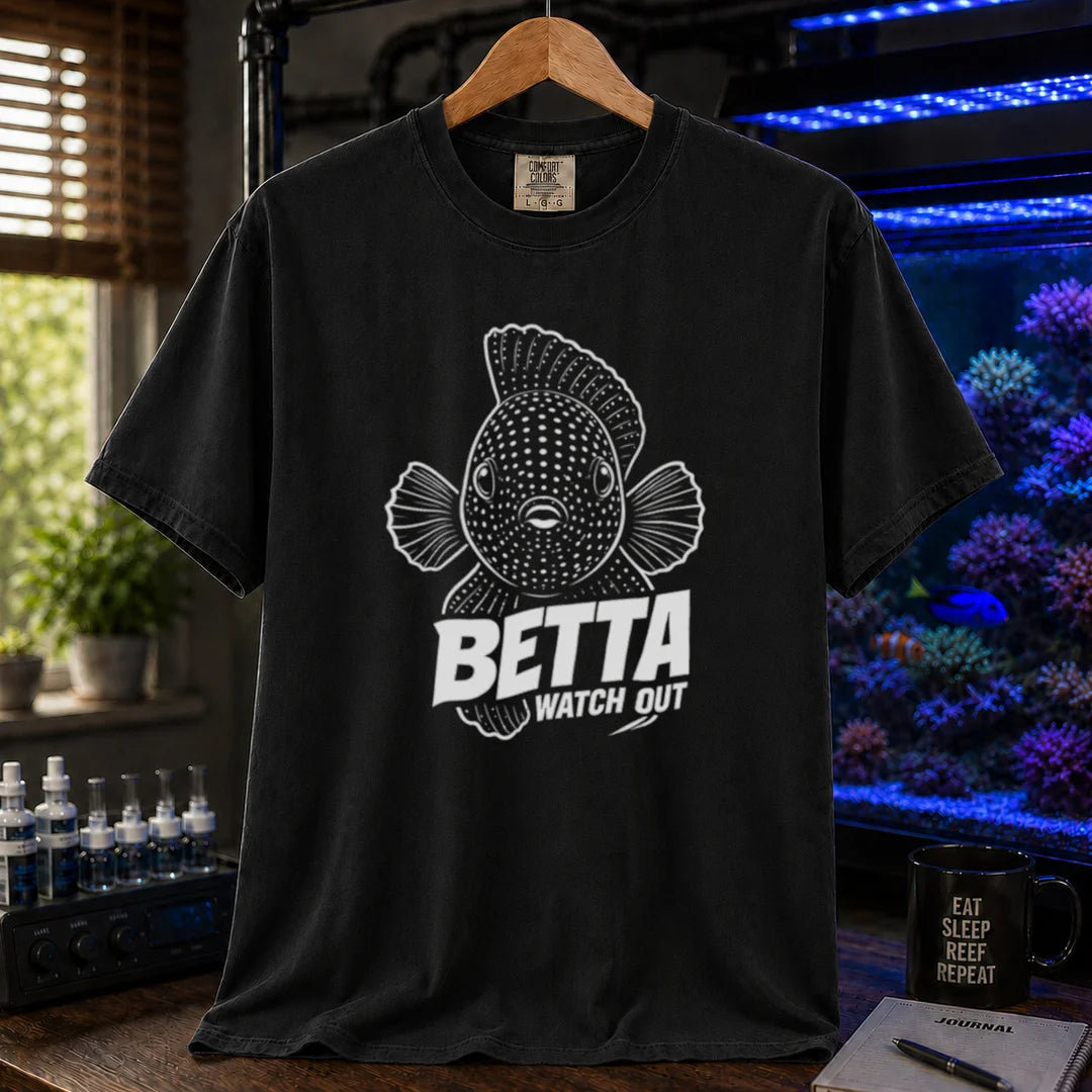 Saltwater aquarium graphic t-shirt featuring a front-facing spotted fish illustration and white typography reading Betta Watch Out on a black shirt