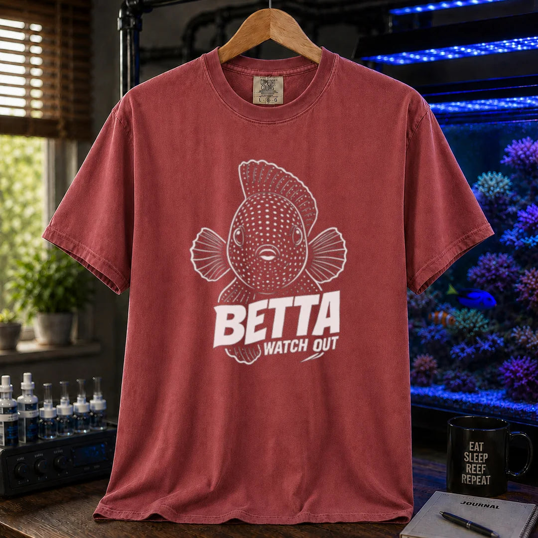 Saltwater aquarium graphic t-shirt featuring a front-facing spotted fish illustration and white typography reading Betta Watch Out on a maroon, red shirt
