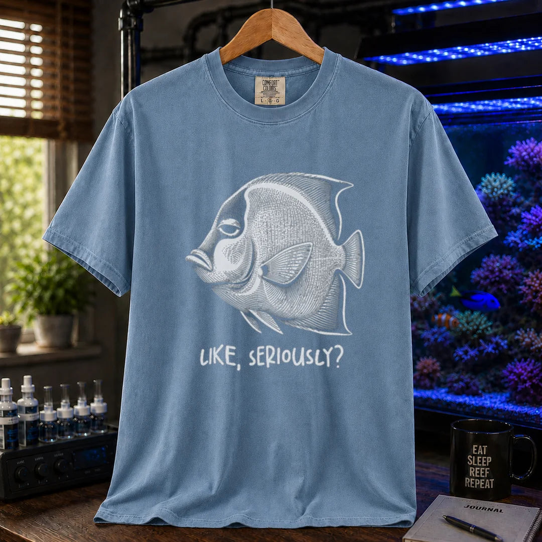 Saltwater aquarium graphic t-shirt featuring a detailed engraving of an unimpressed fish with text reading Like, Seriously? on a blue shirt