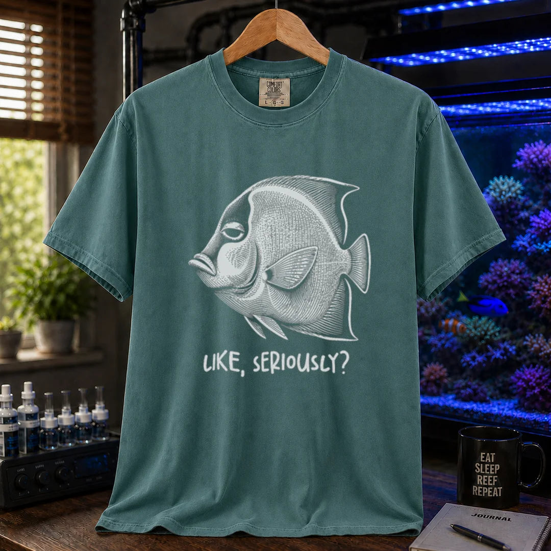Saltwater aquarium graphic t-shirt featuring a detailed engraving of an unimpressed fish with text reading Like, Seriously? on a green shirt