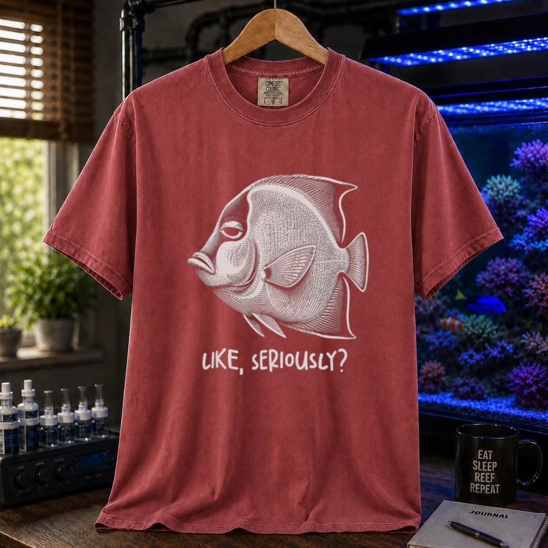 Saltwater aquarium graphic t-shirt featuring a detailed engraving of an unimpressed fish with text reading Like, Seriously? on a maroon, red shirt