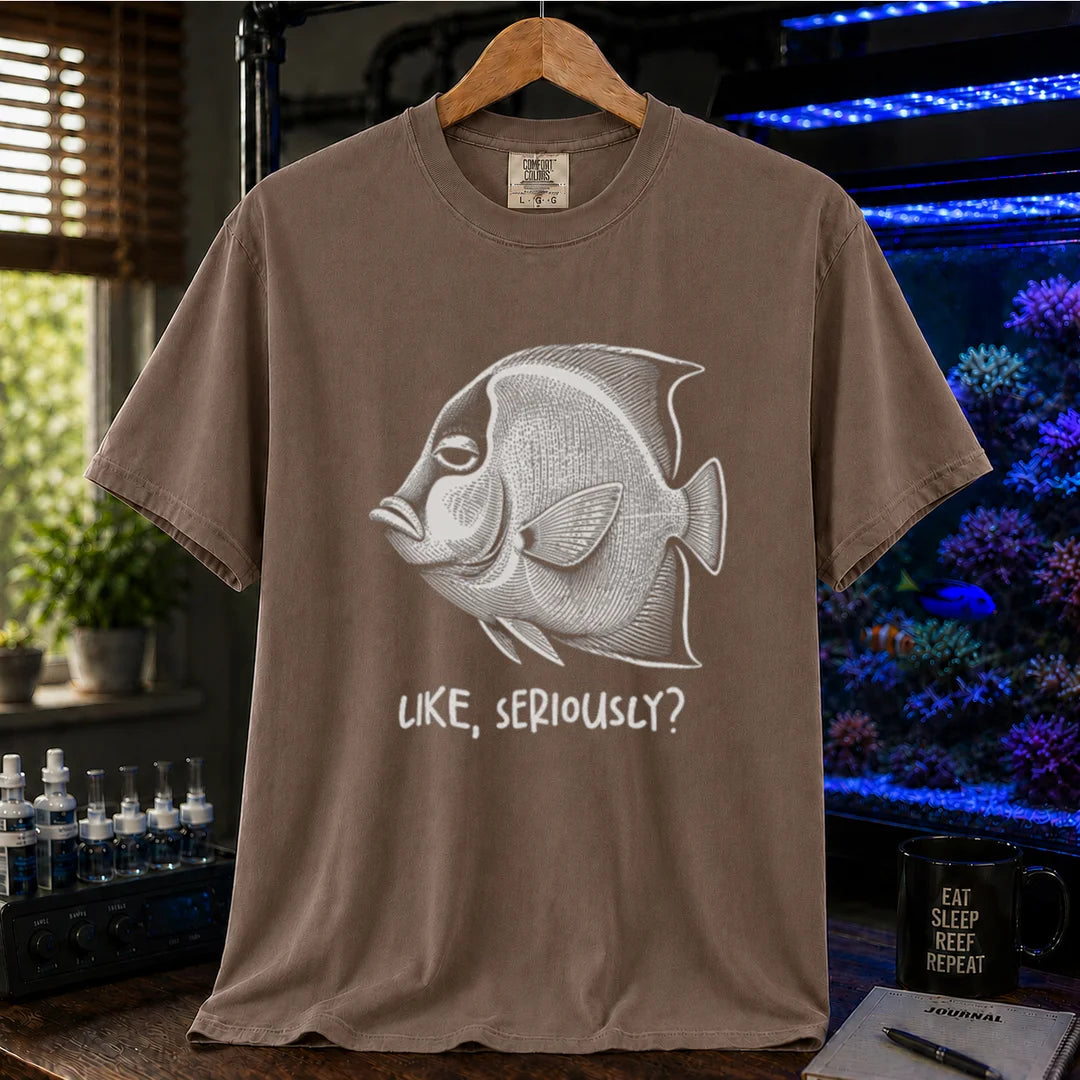 Saltwater aquarium graphic t-shirt featuring a detailed engraving of an unimpressed fish with text reading Like, Seriously? on a brown shirt