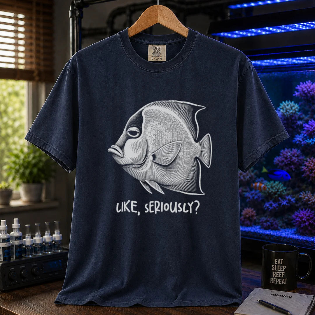 Saltwater aquarium graphic t-shirt featuring a detailed engraving of an unimpressed fish with text reading Like, Seriously? on a navy shirt