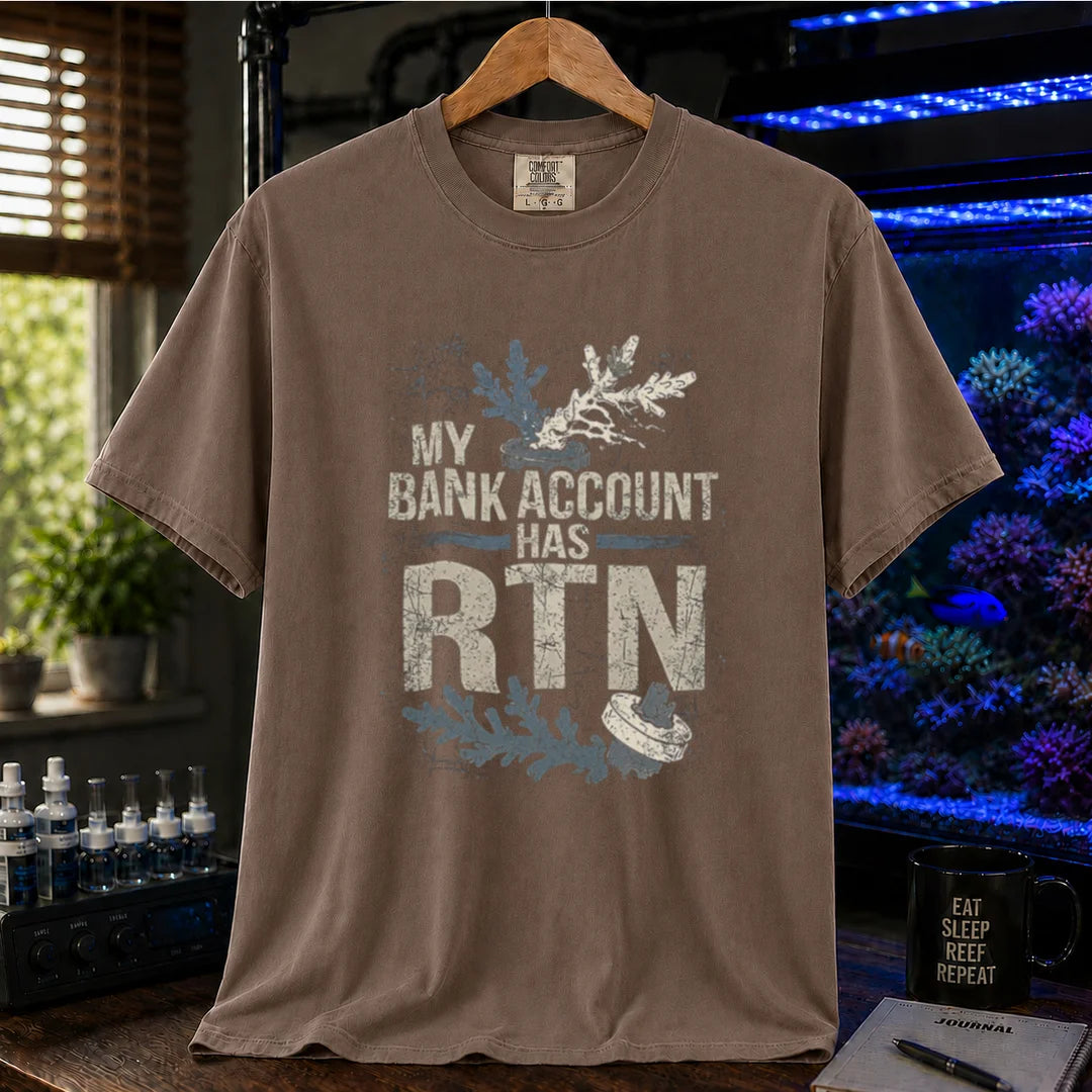 Saltwater aquarium graphic t-shirt featuring distressed typography reading My Bank Account Has RTN alongside dying coral frag illustrations on a brown shirt