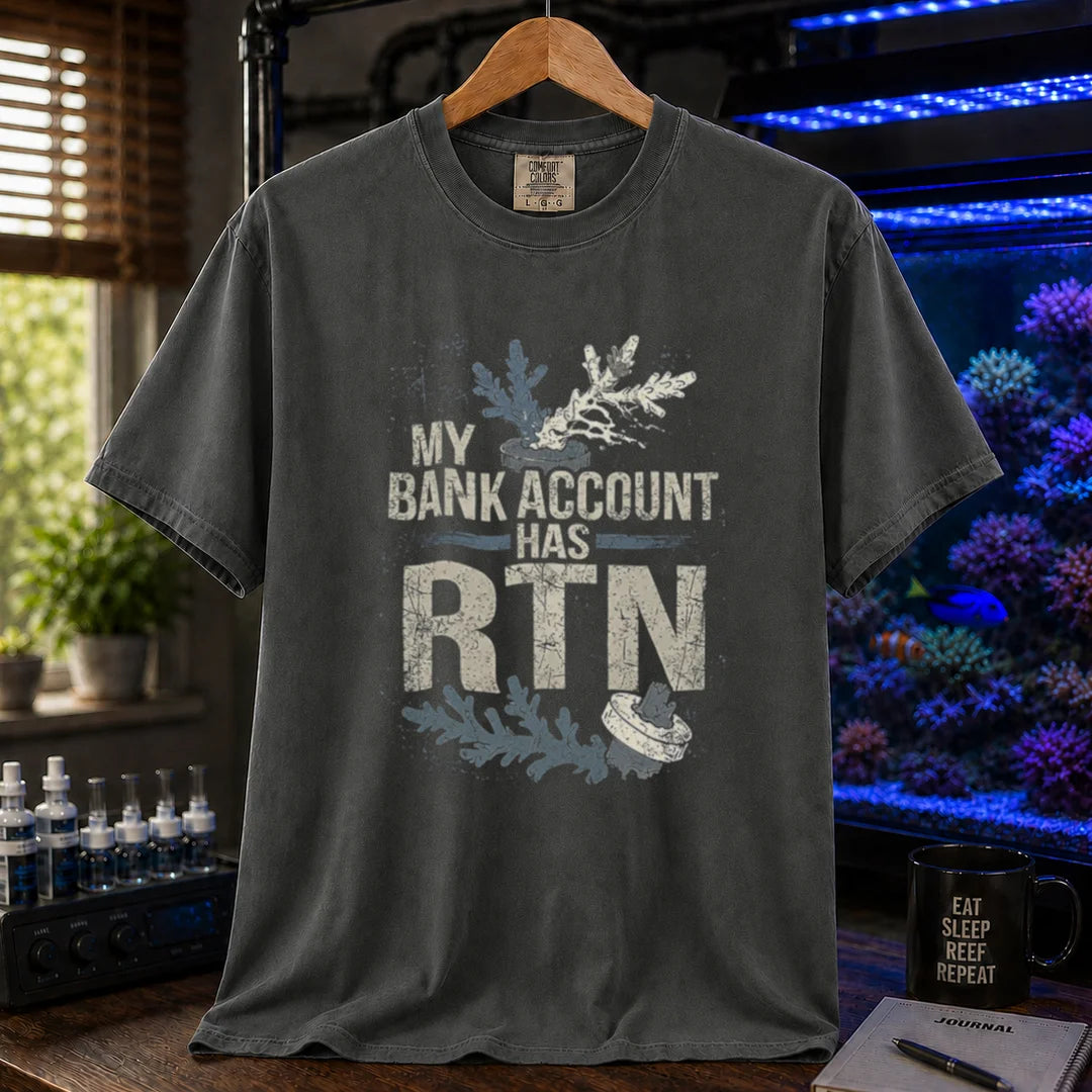 Saltwater aquarium graphic t-shirt featuring distressed typography reading My Bank Account Has RTN alongside dying coral frag illustrations on a dark grey shirt
