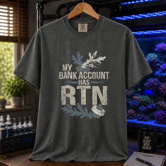 Saltwater aquarium graphic t-shirt featuring distressed typography reading My Bank Account Has RTN alongside dying coral frag illustrations on a dark grey shirt