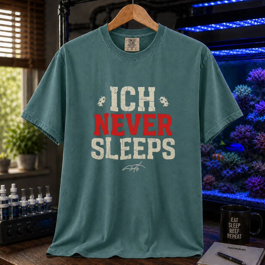 Saltwater aquarium graphic t-shirt featuring distressed typography reading Ich Never Sleeps in white and red with parasite icons on a green shirt