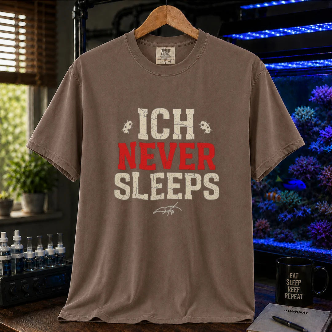 Saltwater aquarium graphic t-shirt featuring distressed typography reading Ich Never Sleeps in white and red with parasite icons on a brown shirt