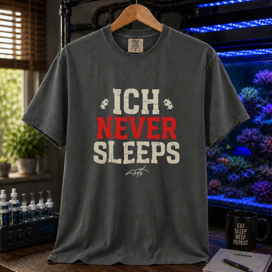 Saltwater aquarium graphic t-shirt featuring distressed typography reading Ich Never Sleeps in white and red with parasite icons on a dark grey shirt