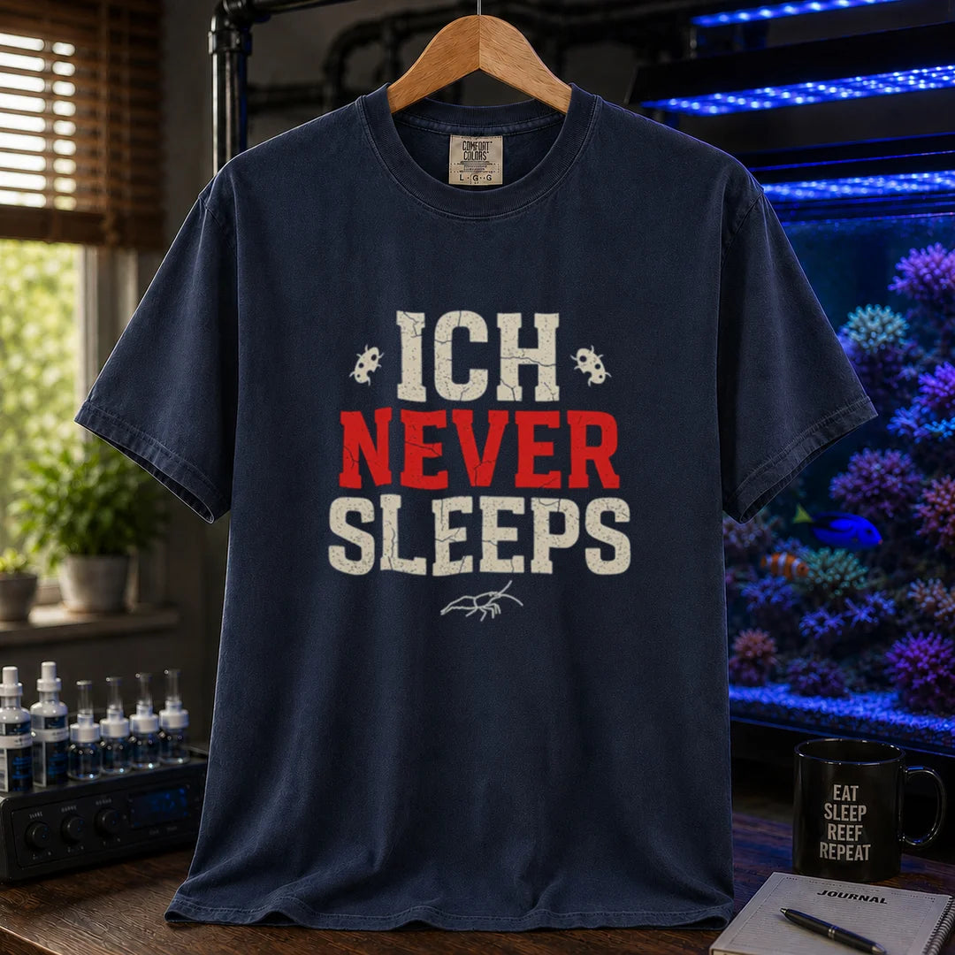 Saltwater aquarium graphic t-shirt featuring distressed typography reading Ich Never Sleeps in white and red with parasite icons on a navy shirt