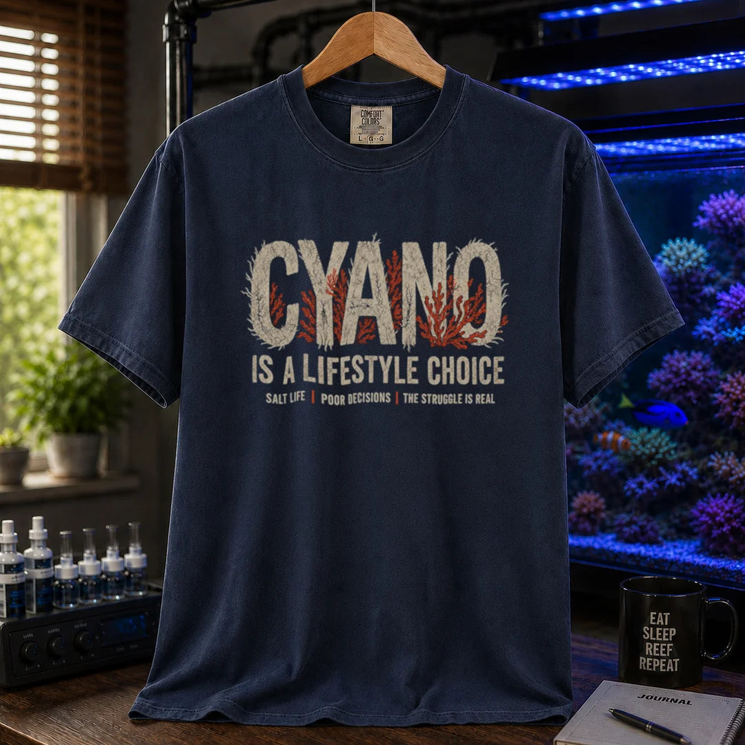 Saltwater aquarium graphic t-shirt featuring distressed typography reading Cyano Is A Lifestyle Choice with red algae details on a navy shirt
