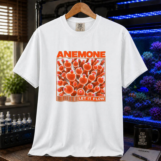 Saltwater aquarium graphic t-shirt featuring distressed multi-row typography reading Respect Your Reef in turquoise, cream, and orange with coral and clownfish accents on a white shirt
