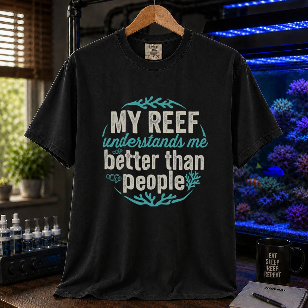 Saltwater aquarium graphic t-shirt featuring distressed circular typography reading My Reef Understands Me Better Than People with clownfish and coral graphics on a  black shirt